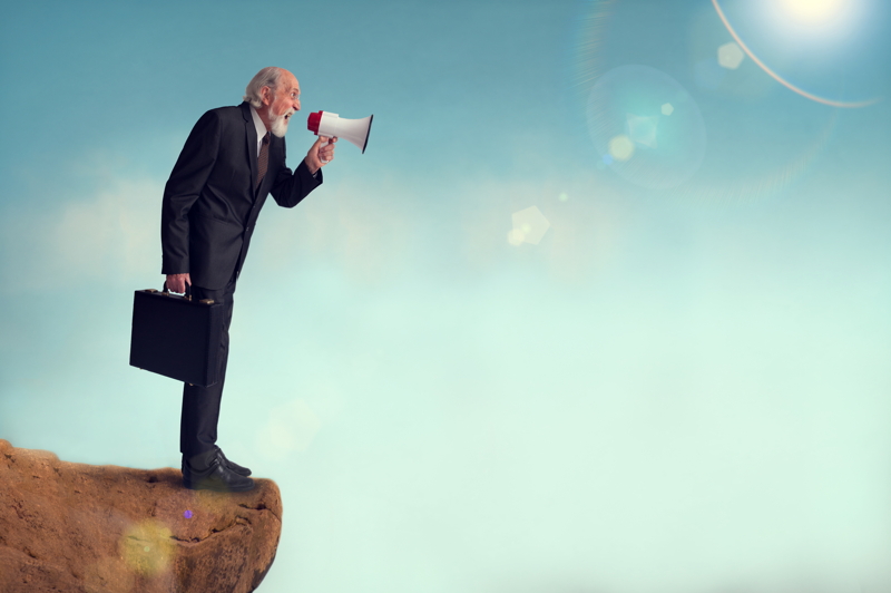Man yelling into a chasm