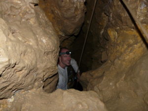 Spelunker offering an introduction to the cave