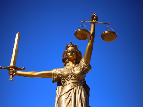 Statue of Justice holding balance scales
