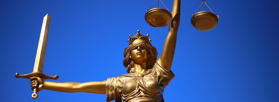 Statue of Justice holding balance scales